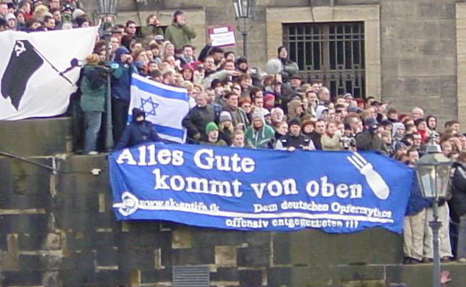 Antifa rally with banner reading &quot;All Good comes from above&quot;