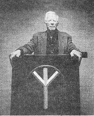 Dr. Pierce delivering a speech from his pulpit.