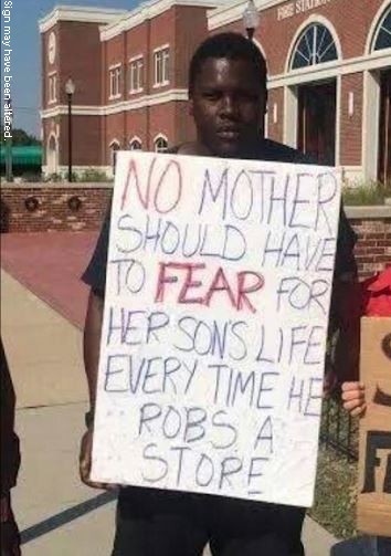 sign-held-by-negro.jpg